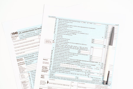 Blanks with tax forms close-up on white background top view.