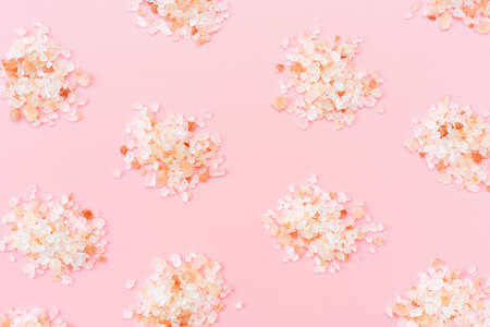 Pattern of heaps of himalayan salt on pink background close-up.の写真素材