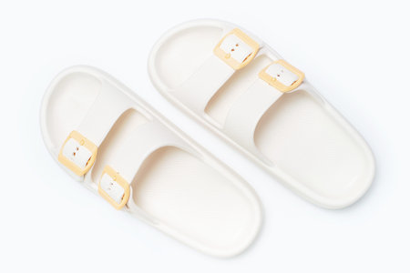 Rubber summer flip-flops on on white background close-up, top view.