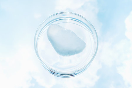 Foam against background of a blue sky and clouds.の写真素材