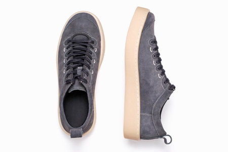 Gray sneakers on white background close-up, top view.の写真素材