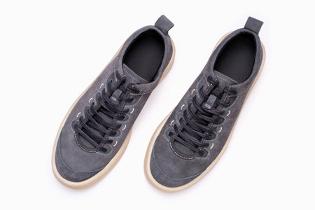 Gray sneakers on white background close-up, top view.の写真素材