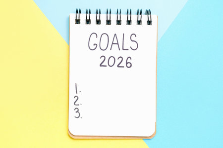 The inscription goals 2026 on notepad on blue and yellow background, top view.の写真素材
