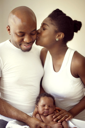 Young black nigerian family with a newborn babyの写真素材