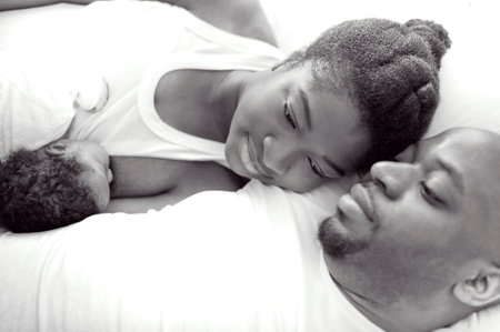 Young black nigerian family with a newborn baby