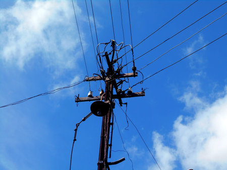      A very old electric light post      