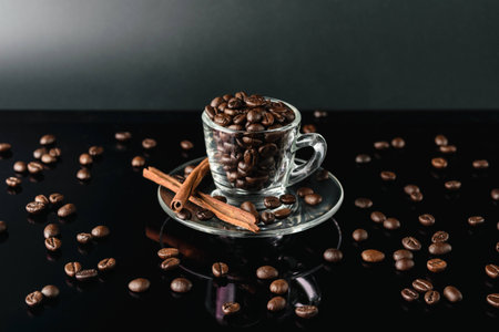 close up coffee bean in cup glass dark backgroundの写真素材