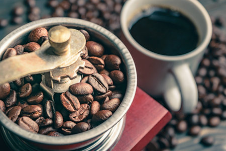 close up coffee bean in grinder and cupの写真素材