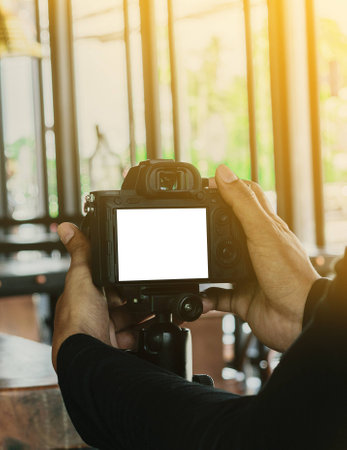 The photographer to take a photo in cafe on the morning.white isolateの写真素材