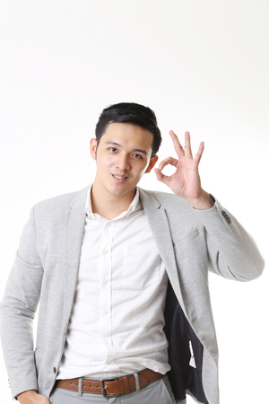 Portrait of Asian Man in Isolated Backgroundの写真素材