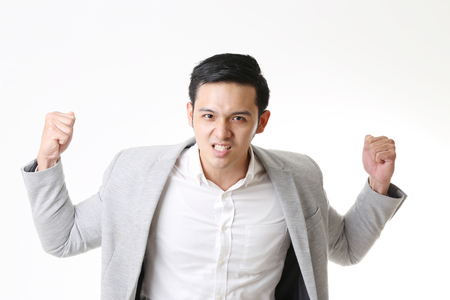 Portrait of Asian Man in Isolated Backgroundの写真素材