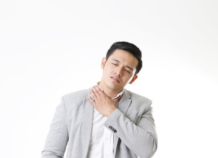 Portrait of uncomfortable Asian Man in Isolated Backgroundの写真素材