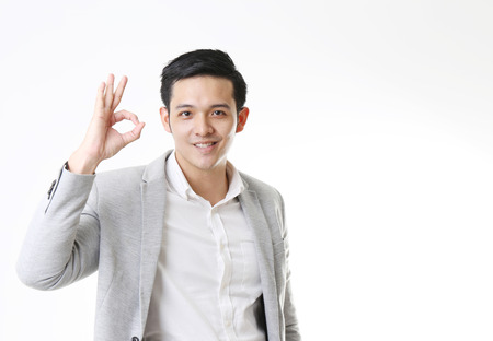 Portrait of Asian Man in Isolated Backgroundの写真素材