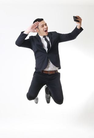 Portrait of Asian Man in Isolated Backgroundの写真素材