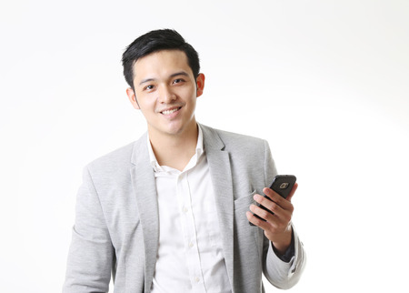 Portrait of Asian Man in Isolated Backgroundの写真素材