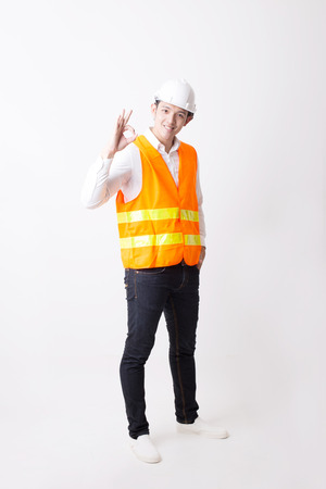 Portrait of Asian Engineer or Architect Designer in Isolated Background With Gesture Signの写真素材