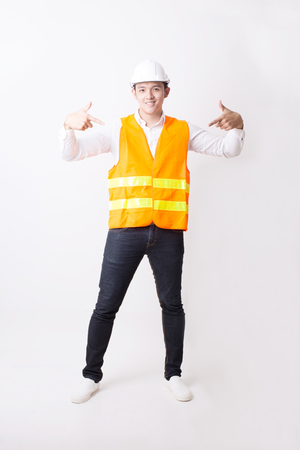 Portrait of Asian Engineer or Architect Designer in Isolated Background With Gesture Signの写真素材