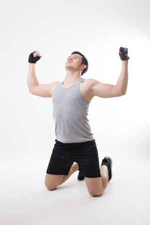 Portrait of Asian Fitness Men in Isolated Background With Gesture Signの写真素材