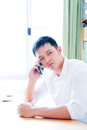 Portrait of Asian Man Isolated With Gesture Signの写真素材