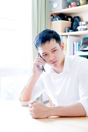 Portrait of Asian Man Isolated With Gesture Signの写真素材