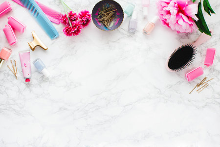 Pink set of hair accessories on marble table
