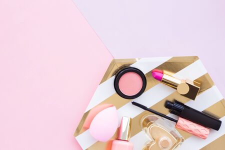 Make up products close up on pinkの写真素材