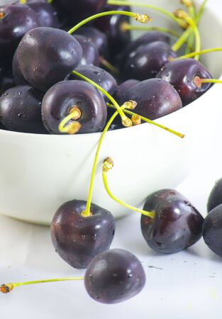 Cherries in white cupの写真素材
