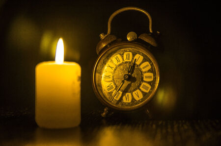 Candle, watch and time..の写真素材