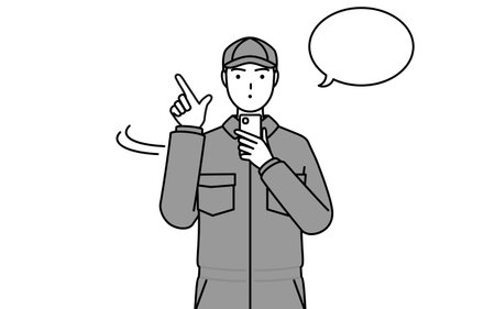 A mechanic in coveralls operating a smartphone, Vector Illustrationのイラスト素材