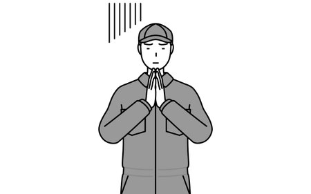 A mechanic in coveralls apologizing with his hands in front of his body, Vector Illustrationのイラスト素材