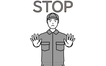 A mechanic in coveralls with his hands out in front of his body, signaling a stop, Vector Illustrationのイラスト素材
