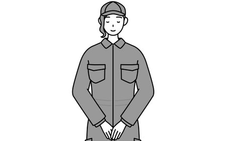 A mechanic woman in coveralls with hands on top of each other in front of their bodies, Vector Illustrationのイラスト素材