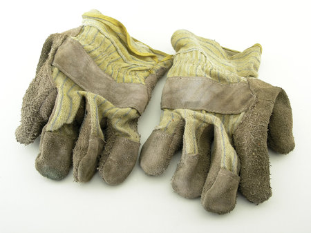 a worn pair of gardening glovesの写真素材