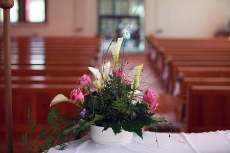 Very nice flower arrangement on the altar in the church before the wedding.の写真素材