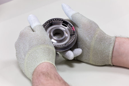 A Employee introduces a visual inspection of a synchronizer ring