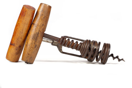 Two old corkscrews on white background