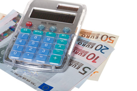 Pocket calculator and Euro Banknotes isolated on white background