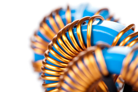 Detail Close-up View of three Industrial Toroidal Choke Coil isolated on White Backgroundの写真素材