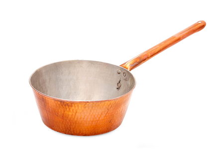 Old copper saucepan isolated in a white background の写真素材
