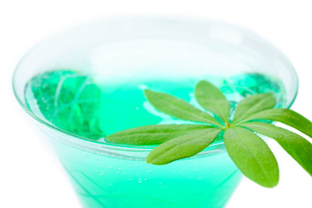 Close up woodruff punch with woodruff leaf isolated front of white background