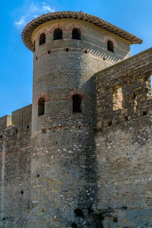 Large defensive tower and fortress wall with the battlements of the historic fortification Carcassonne in Franceのeditorial素材