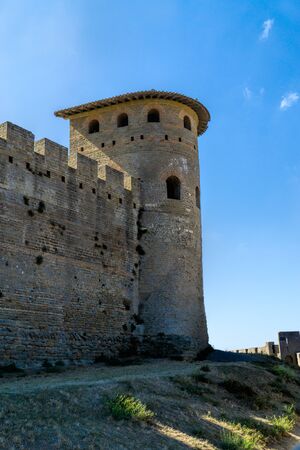 Large defensive tower and fortress wall with the battlements of the historic fortification Carcassonne in Franceのeditorial素材