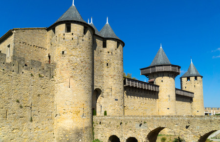 View of the bridge, towers and part of the fortifications walls in the historic medieval fortified town of Carcassonneのeditorial素材