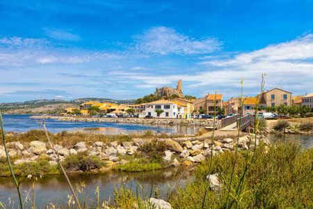 The medieval village of Gruissan in southern France with the ancient castle ruin of Barberousse located at the Etang de Gruissan.の写真素材