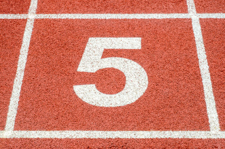 The number 5 at the start or finish position   on race track の写真素材