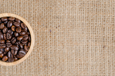 The coffee beans on the hessian sack  for background , texture , copy textの写真素材