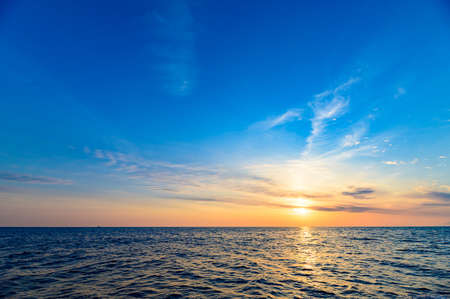 The beautiful orange morning sun rising on the Genkai Seaの写真素材