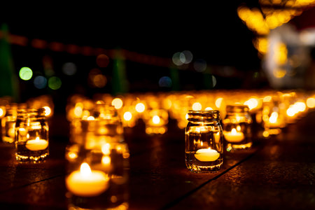 A romantic night view of the building lit up with bright glass lanterns and wooden illuminations at...
