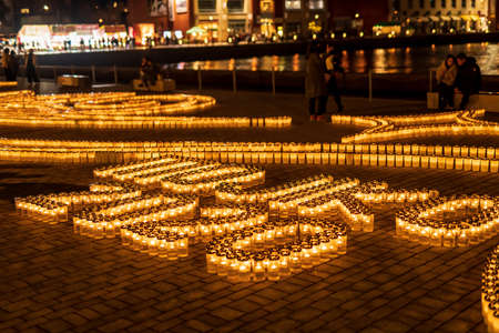 A romantic night view of the building lit up with bright glass lanterns and wooden illuminations at Mojiko Retroの写真素材