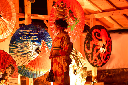 Beautiful festival lit up with bamboo lanterns and Japanese umbrellasのeditorial素材